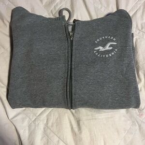 Grey zip up hoodie size: small brand: Hollister